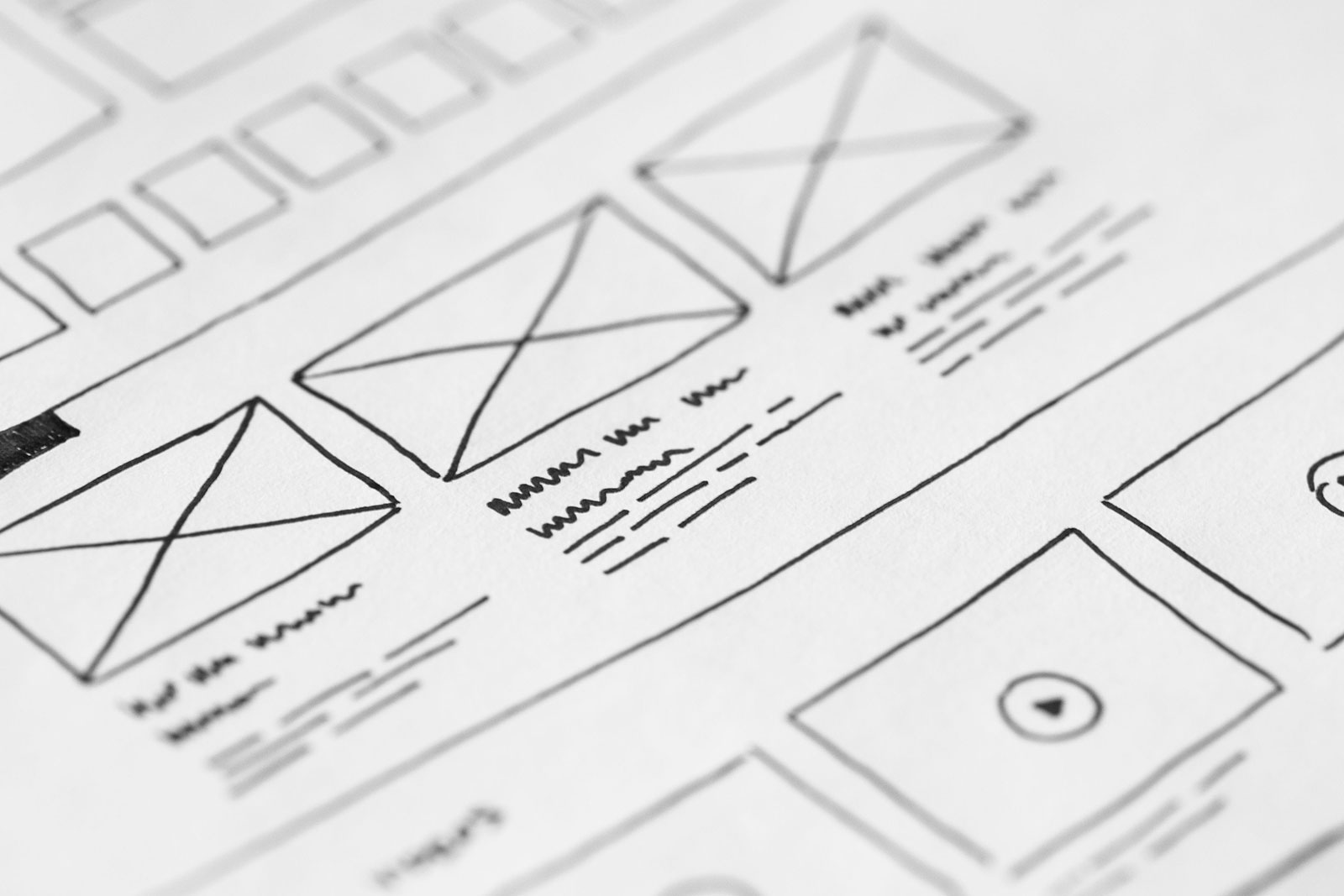 Hand-drawn website wireframe sketches in a notebook — part of the web design planning process at Nimarmi